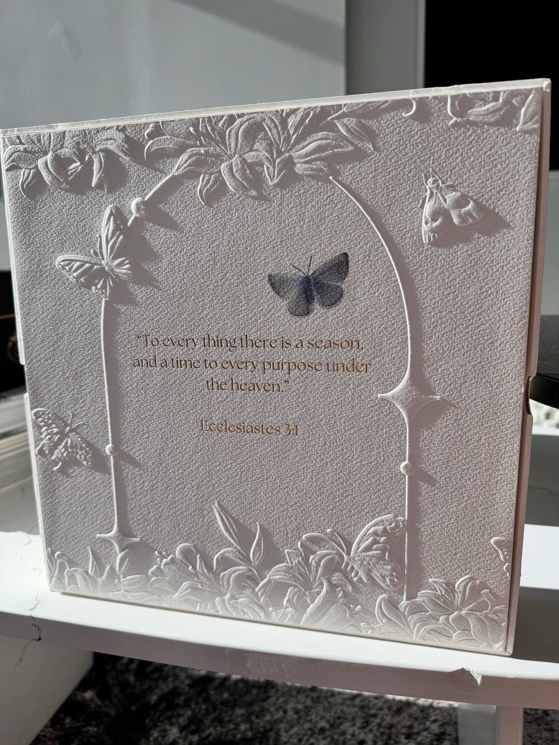 Full view of the Posoulo gift box back featuring relief artwork and Ecclesiastes 3:1